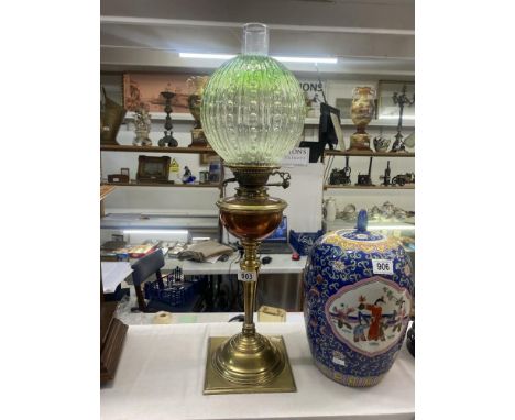 A Victorian brass &amp; copper oil lamp with green glass shade 