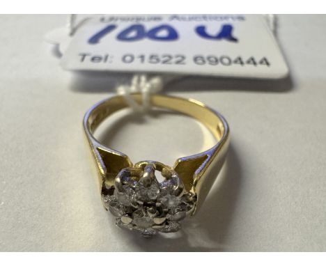 A diamond ring, bright diamonds in a cluster design, HM 18ct London 1979, tapering shoulders, size K, 3.9 grams
