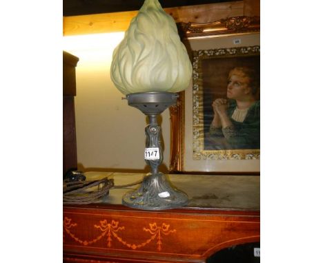 An Edwardian table lamp with flame shade. 
