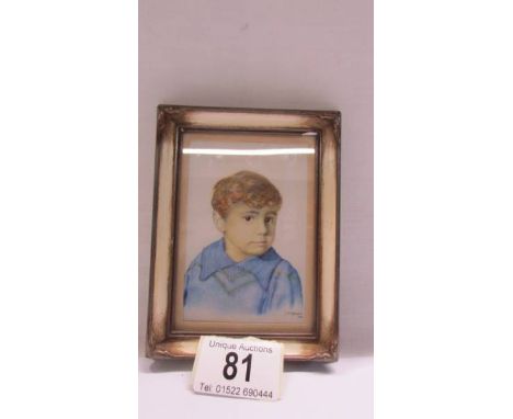 G H Wybrants (early 20th C) framed &amp; glazed oil on ivorine portrait of a young boy, signed &amp; dated 1912.