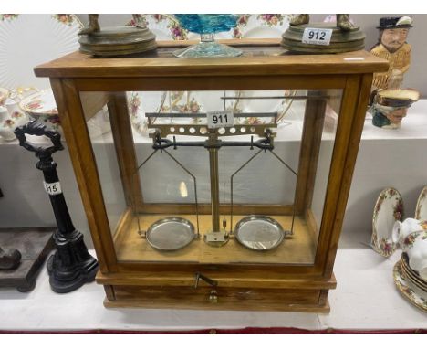 A set of balance scales in case 
