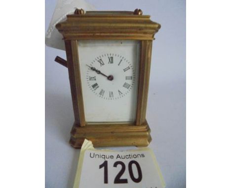 A miniature brass carriage clock,&nbsp; &nbsp;in working order.