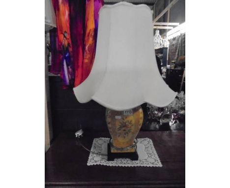 A pottery table lamp with shade. 