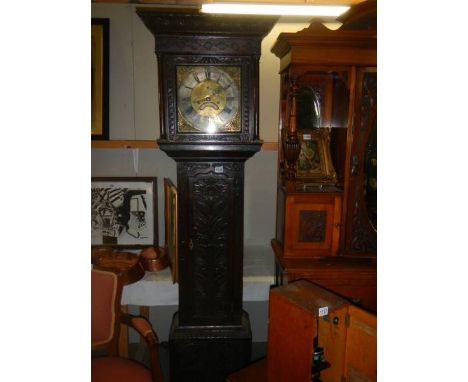 An early carved oak eight day Grandfather clock, complete.