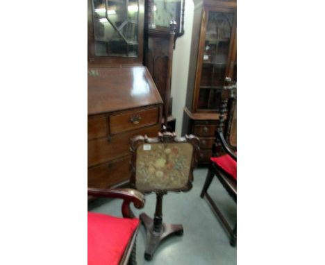 A Victorian mahogany pole screen with tapestry panel. 