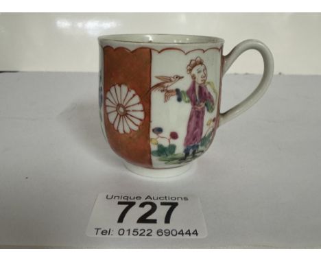 An 18th century Worcester tea cup, The chinoiserie inspired design depicting panels of hand painted figures and flowers, spac