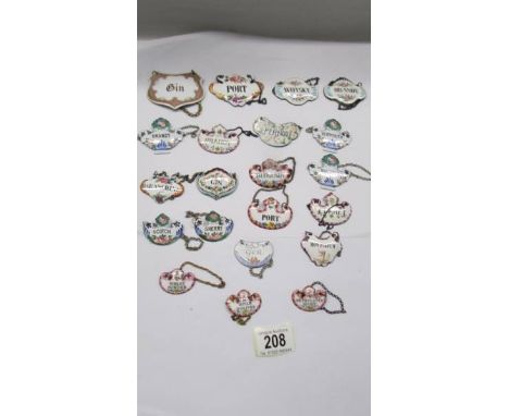 Twenty one old enamel decanter lables. 