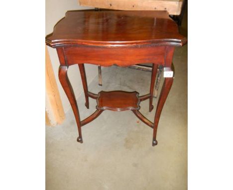A small mahogany fold-over card table. 