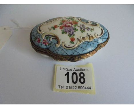 A 19th century porcelain trinket box.
