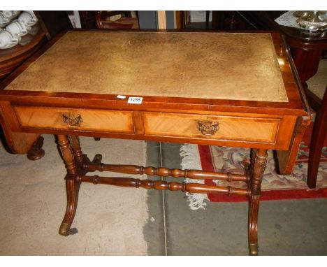 A mid 20th century sofa table with leather inset top. 