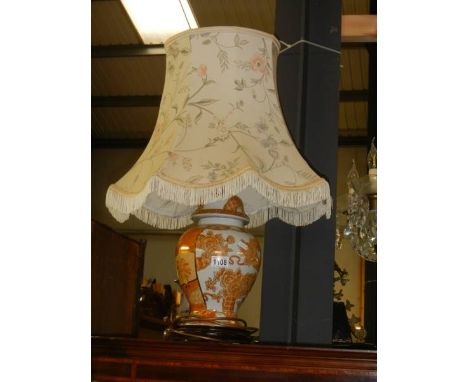 A pottery table lamp with shade. 