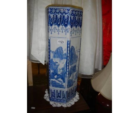 A blue and white ceramic stick/umbrella stand.No visible damage.Height 62cm.