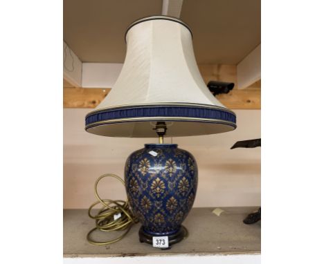 A Decorative ginger jar shaped lamp with shade 