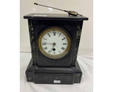 A Victorian black slate mantle clock 