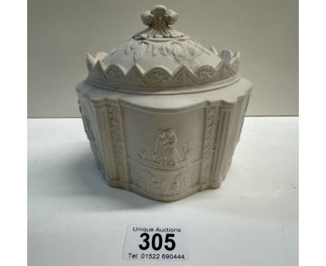An early 19th century salt glaze sugar caddy with lid. Relief decorated with mourning figures. A/F 
