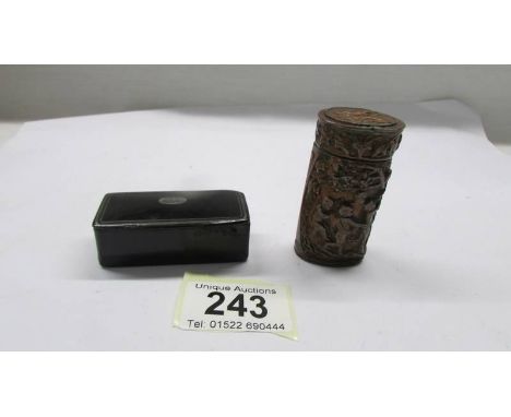 A lacquered snuff box and a match holder with striker. 