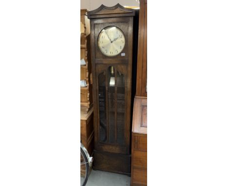 A 1930s oak longcase clock with 3 weights 