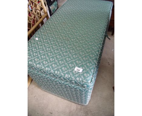 Travelling trunk re-covered and converted to an ottoman 