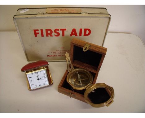 Vintage First Aid tin box, reproduction cased brass naval compass and a travelling clock 