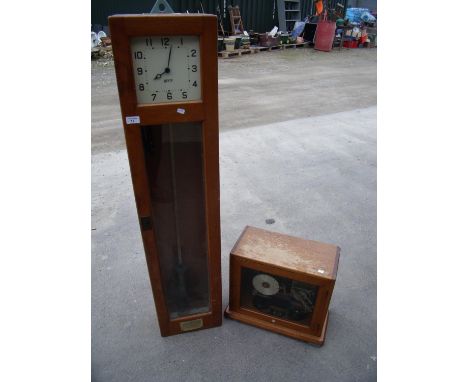 Gents of Leicester clocking-in machine in light wood case with electrical clock mechanism, pendulum and separate clocking-in 