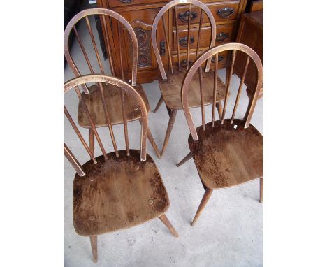 Four Ercol stick back dining chairs 
