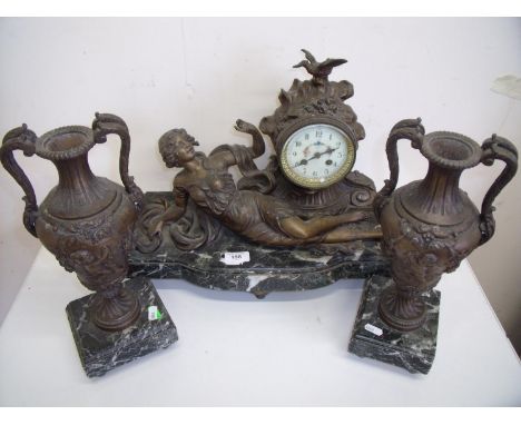 Late Victorian spelter and marble clock, set with enamel dial and mounted with a figure of a reclining lady, with a pair of u