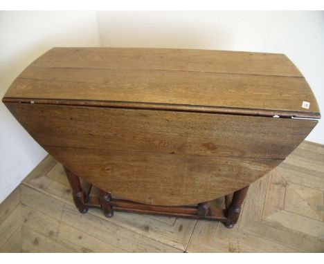 19th C oak drop leaf gate leg table with single drawer to one end, on turned supports 