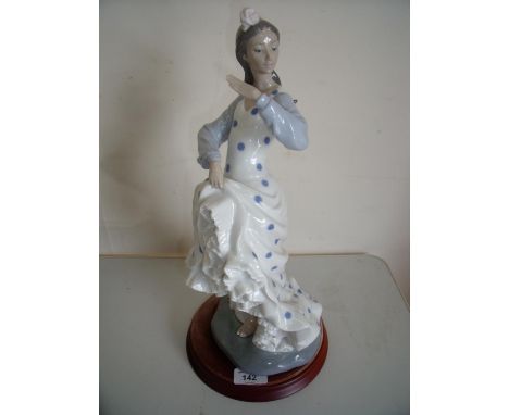 Large Nao figure of a dancing girl on wooden plinth (height 40cm) 