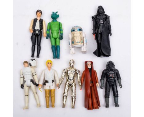 A group of vintage Star Wars figures:  'Darth Vader', 'Han Solo', 'Luke Skywalker' , 'Greedo', TIE-fighter pilot', Obi Wan Ke