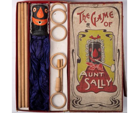 An Edwardian wooden 'The Game of Aunt Sally' set in original box by Spears of Bavaria: with wooden headed Aunty Sally in blue