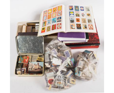 A collection of vintage and modern matchbox covers: some loose and some mounted in albums and related ephemera.