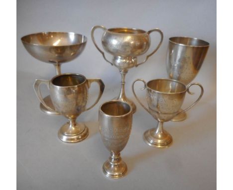 Six assorted silver trophy cups, various makers and dates: all awarded to H.M.Hicks, includes The B.M.C.&amp; L.C.C. Lands En