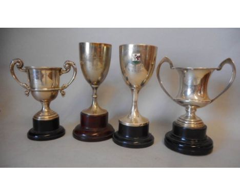 Four assorted silver trophy cups, various makers and dates; inscribed, Cardiff-Leicester-Cardiff Trial, 1929, Surbiton Motor 
