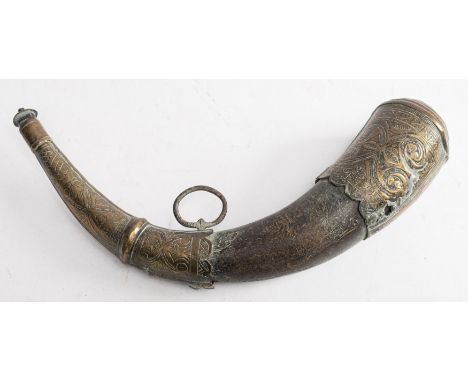 A Persian  brass mounted horn powder flask:  with floral decoration to mounts, iron suspension ring, 35cm long