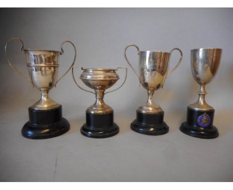 Four assorted silver trophy cups, various makers and dates: all awarded to H.M.Hicks, includes; W.C.A.C.U. Cotswold Cup 1927 