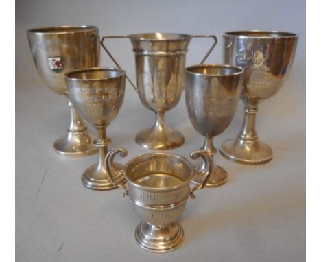 Six assorted silver trophy cups, various makers and dates: all awarded to H.M.Hicks, includes; Cardiff-Leicester-Cardiff Tria