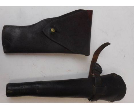 A leather holster: a stitched leather bugle holster and Indian percussion cap carbine.