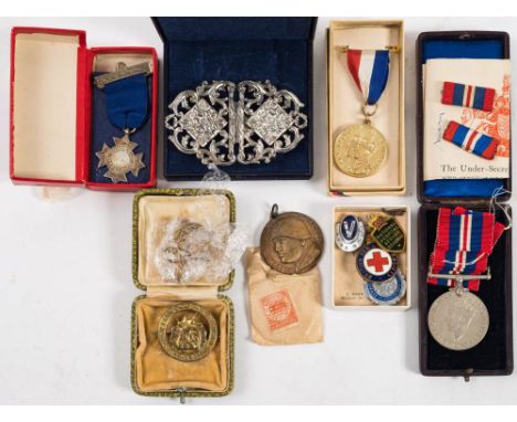 A WWII War Medal together with a collection of enamel badges etc. : including  Girl Guides, Red Cross and others , also an It