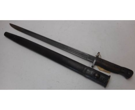 A 1907 bayonet by Wilkinson, Pall Mall, with 43.5cm fullered blade and wood slab grip, contained in a leather and steel mount