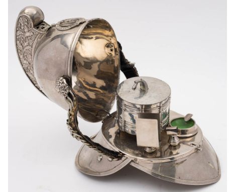 An early 20th century Merryweather pattern auxiliary fire helmet converted as a smokers companion: the plated helmet separate