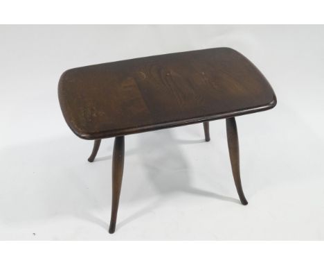 An Ercol beech stained coffee table with turned tapering legs, bears makers label, 42cm high x 70cm wide x 42.5cm deep