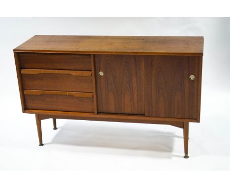 A small G-plan sideboard, with three drawers and cupboard with sliding doors enclosing a single shelf, 76cm high x 125cm wide