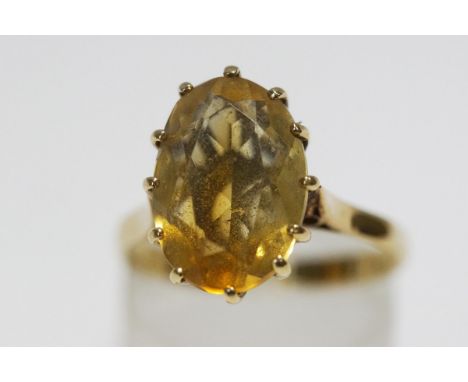 A single stone citrine 9 carat gold ring, finger size O, 3.4 g gross, cased