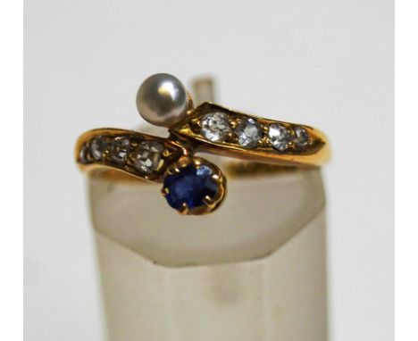 A late Victorian sapphire, diamond and pearl 18 carat gold cross over ring, Birmingham 1889, the pearl (untested and unwarran