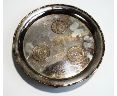 A Chinese coin set salver, stamped 'Wai Kee', Sterling Silver' and 'Made in Hong Kong', with bamboo border, on three scroll s