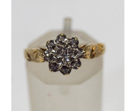 A 9 carat gold diamond cluster ring, with illusion set single cuts, finger size N, 1.9 g gross