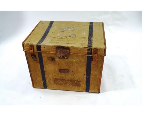 A large vintage canvas and leather bound trunk, 63cm high x 83cm wide x 63cm deep