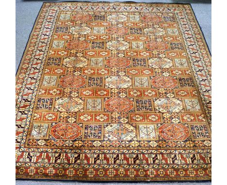 A large Middle Eastern machine woven carpet, with geometric design , 413 cm x 320 cm