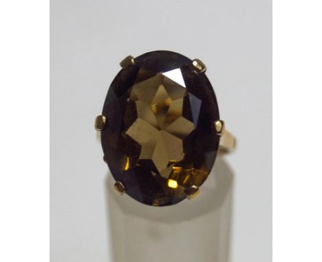 A 9ct gold single stone smokey quartz dress ring, finger size N1/2, 6.8 g gross, cased