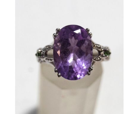An amethyst and gem set dress ring, the white mount stamped '9K', finger size N, 4.7 g gross